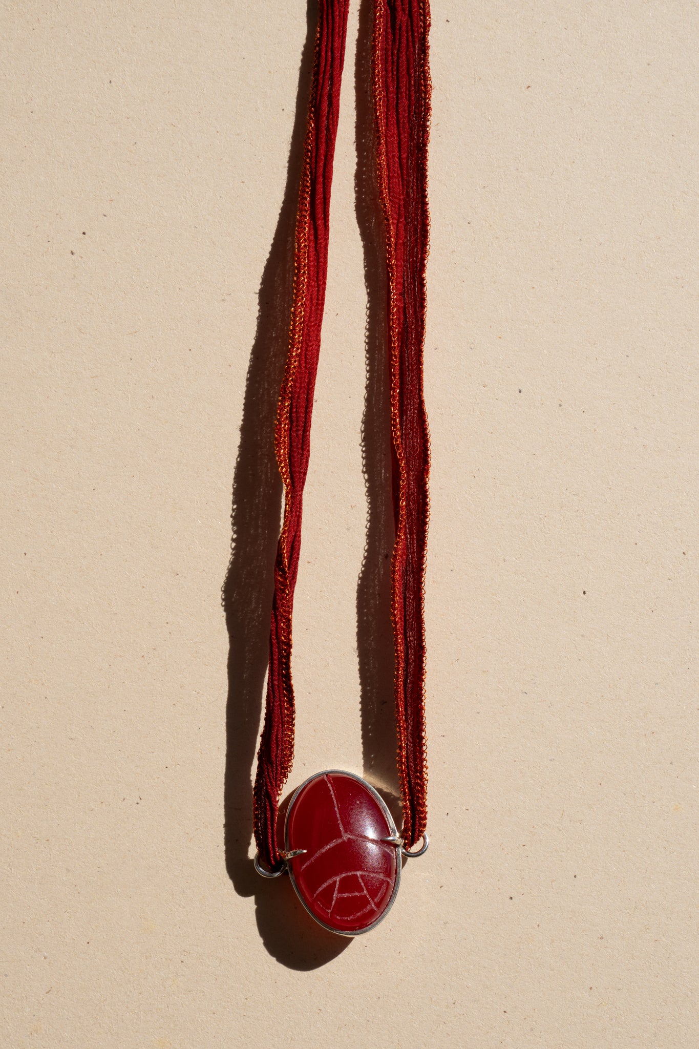 Red Egyptian scarab Chocker on red Silk