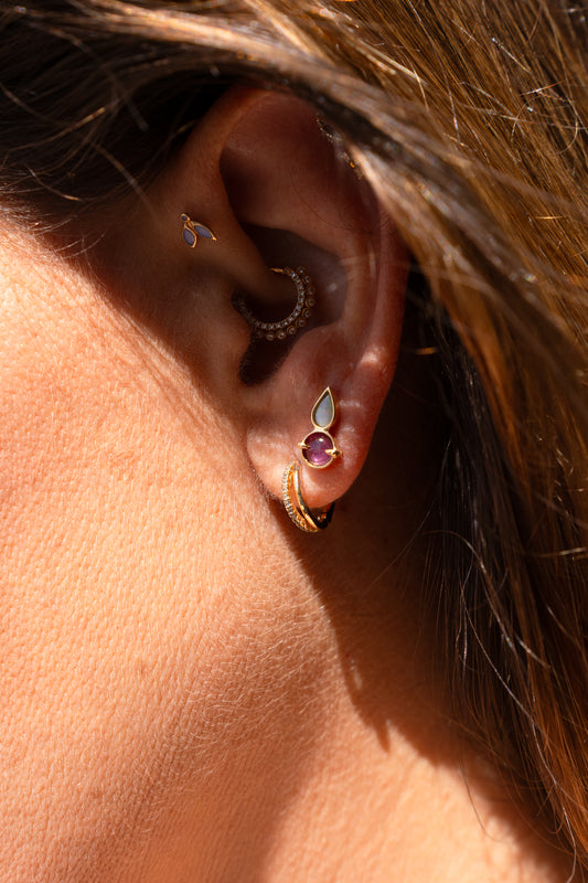 Piercing round ruby and white opal