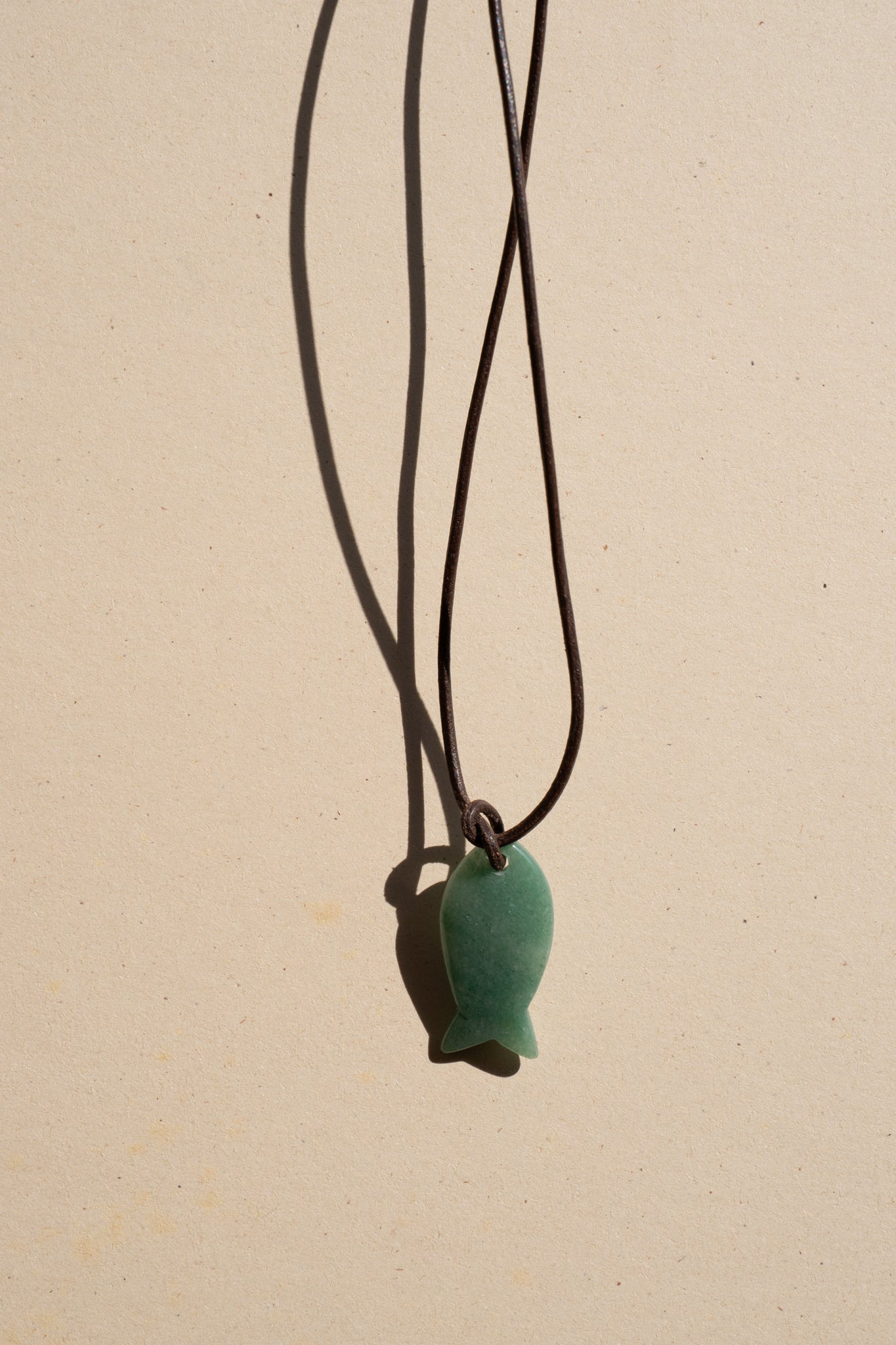 Jade Fish on Brown Leather