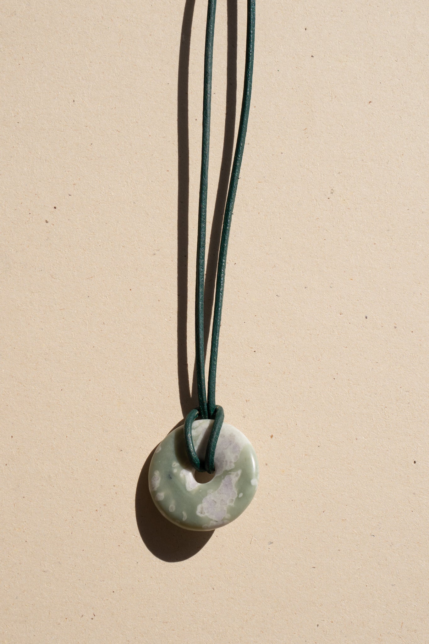 Serpentine Donut on Green Leather