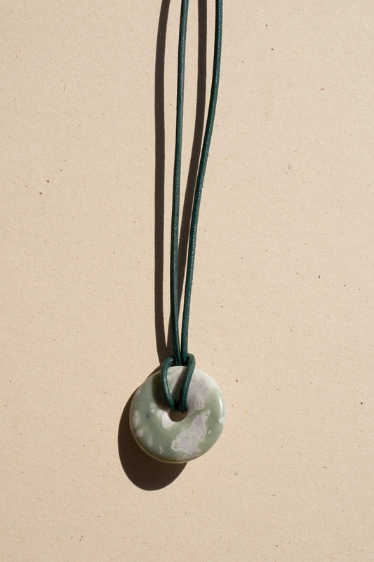 Serpentine Donut on Green Leather
