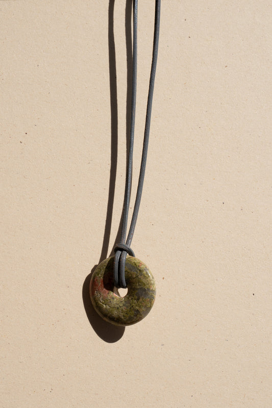 Dragon Blood Jasper Donut on Gray Leather