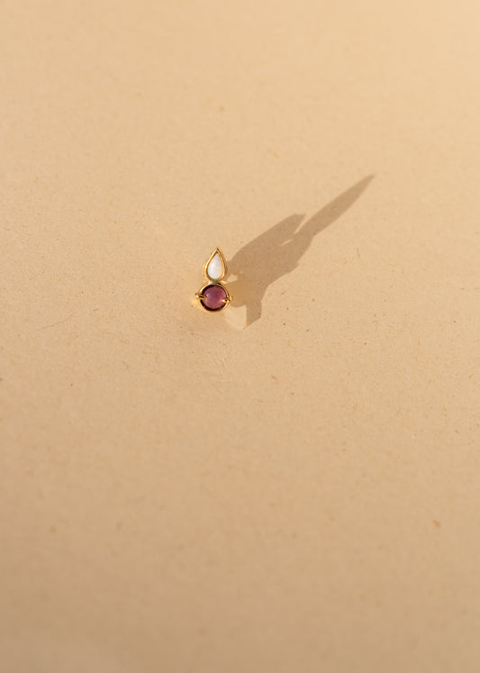 Piercing round ruby and white opal